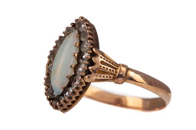 Lot 309 - AN OPAL AND GEM SET RING