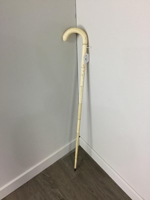 Lot 208 - A BONE WALKING STICK