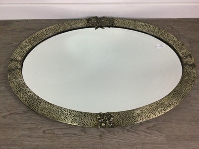 Lot 224 - AN OVAL WALL MIRROR