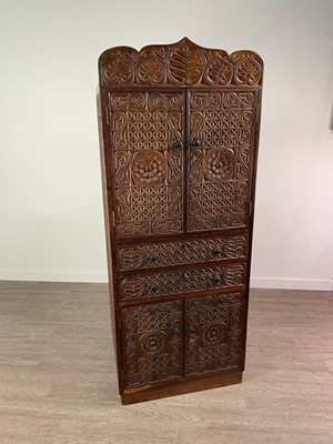 Lot 318 - AN EAST AFRICAN CARVED CUPBOARD