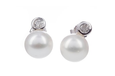 Lot 936 - A PAIR OF PEARL AND DIAMOND EARRINGS