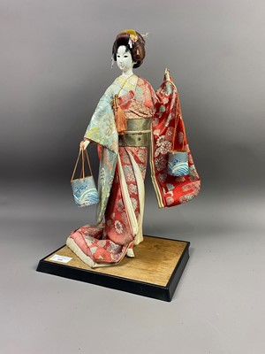 Lot 399 - A JAPANESE DOLL IN SILK ROBES