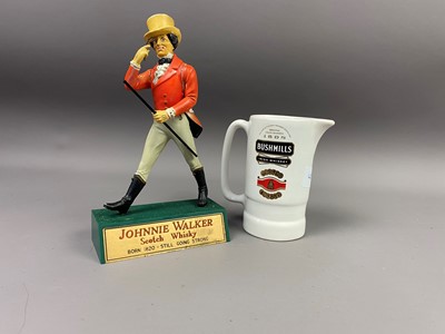 Lot 410 - A JOHNNIE WALKER ADVERTISING FIGURE AND A BUSHMILLS WATER JUG