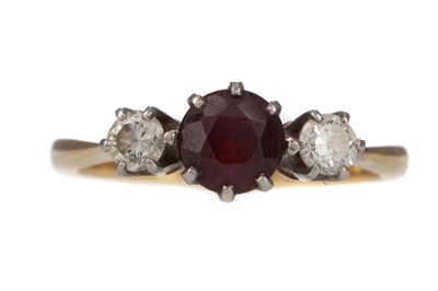 Lot 340 - A SYNTHETIC RUBY AND DIAMOND THREE STONE RING