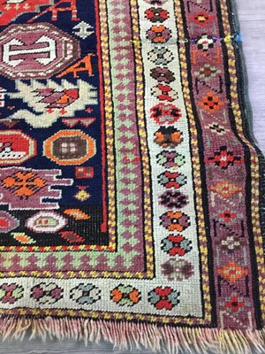 Lot 1667 - A CAUCASIAN BORDERED RUG