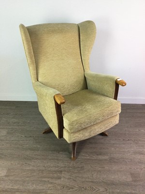 Lot 515 - A RETRO WING BACK ROCKING SWIVEL ARMCHAIR