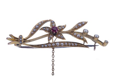 Lot 370 - A SYNTHETIC RUBY AND SEED PEARL FLORAL SPRAY BROOCH