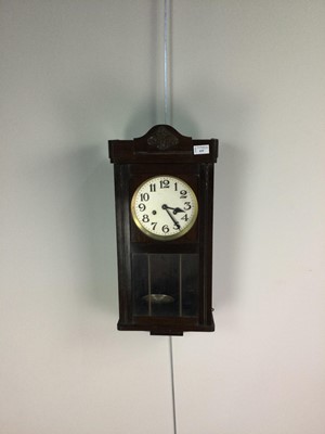 Lot 635 - AN EARLY 20TH CENTURY MAHOGANY WALL CLOCK