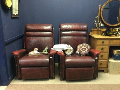 Lot 647 - A PAIR OF OXBLOOD LEATHER RECLINER ARMCHAIRS