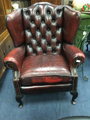 Lot 648 - AN OXBLOOD LEATHER WINGBACKED ARMCHAIR