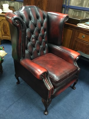 Lot 649 - AN OXBLOOD LEATHER WINGBACKED ARMCHAIR