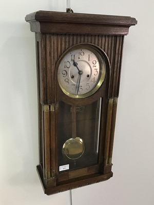 Lot 654 - AN EARLY 20TH CENTURY OAK WALL CLOCK ALONG WITH A CHINESE WOODEN CRATE