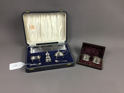 Lot 681 - A CASED SILVER CRUET SET, ALONG WITH A CASED PAIR OF SILVER NAPKIN RINGS