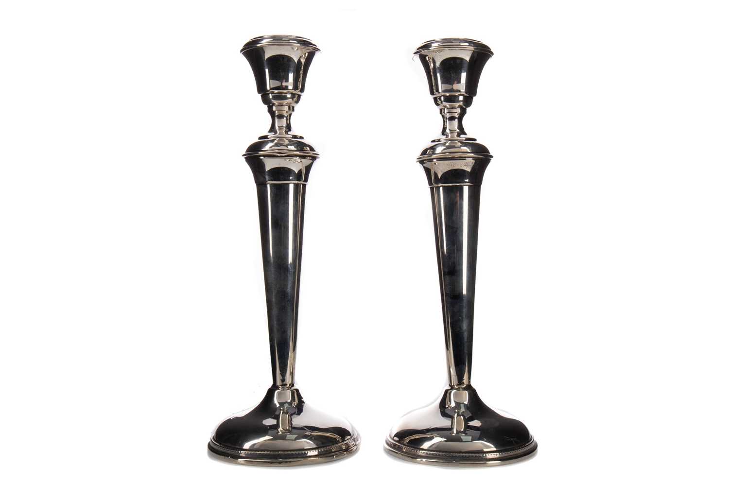 Lot 465 - A PAIR OF GEORGE V SILVER CANDLESTICKS