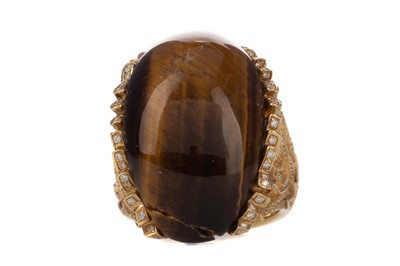 Lot 555 - A TIGERS EYE AND DIAMOND RING