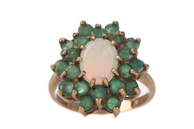 Lot 556 - AN OPAL AND EMERALD CLUSTER RING