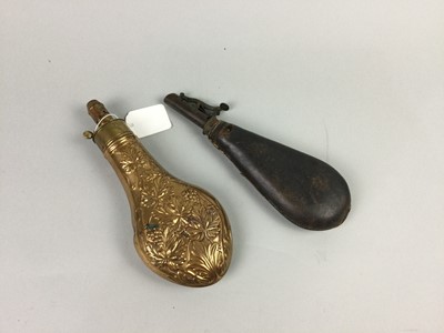 Lot 27 - A 19TH CENTURY BRASS POWDER FLASK AND ANOTHER
