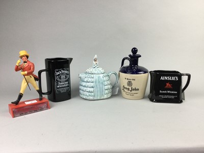 Lot 48 - A JOHNNIE WALKER ADVERTISING FIGURE ALONG WITH WHISKY ADVERTISING JUGS