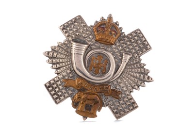 Lot 4 - AN EARLY 20TH CENTURY HIGHLAND LIGHT INFANTRY WHITE METAL CAP BADGE