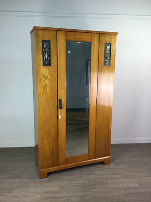 Lot 131 - AN EDWARDIAN ART NOUVEAU OAK WARDROBE AND MATCHING DRESSING CHEST, AND ANOTHER CHEST