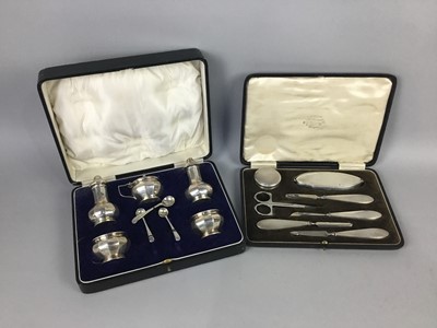 Lot 4 - A GEORGE V SILVER FIVE PIECE CRUET AND A CASED VANITY SET
