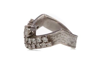 Lot 1179 - A DIAMOND WISHBONE RING
