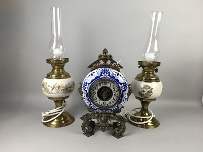 Lot 208 - A CERAMIC AND GILT METAL MANTEL CLOCK AND A PAIR OF TABLE LAMPS