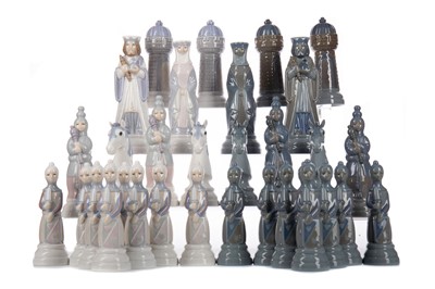 Lot 764 - A LLADRO FIGURAL CHESS SET, ALONG WITH A GAMES TABLE
