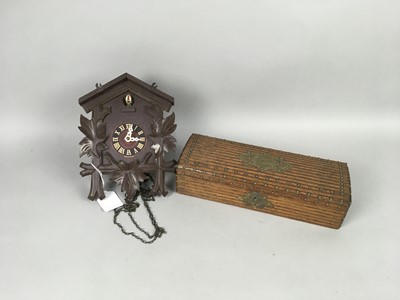 Lot 232 - A LATE 19TH CENTURY BRASS MOUNTED WOOD GLOVE BOX AND A CUCKOO CLOCK