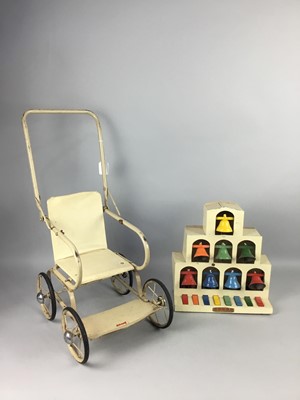 Lot 236 - A VINTAGE TRI-ANG DOLLS' PRAM AND A KODEG TINPLATE MUSICAL TOY