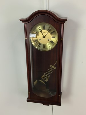 Lot 256 - A MAHOGANY WALL CLOCK BY BAGGOT