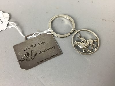 Lot 262 - A SILVER KEYRING AND TAG