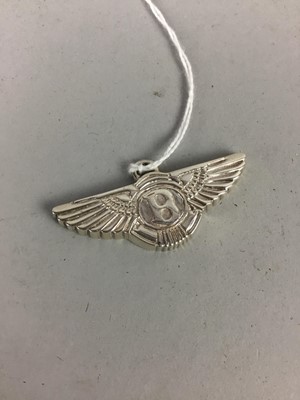 Lot 261 - A WHITE METAL PENDANT IN THE FORM OF THE BENTLEY LOGO