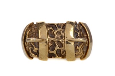 Lot 581 - A NINE CARAT GOLD BUCKLE RING