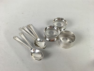 Lot 322 - A SET OF SIX SILVER TEASPOONS ALONG WITH THREE SILVER NAPKIN RINGS