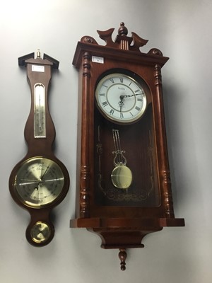 Lot 21 - AN ACTIM WALL CLOCK, ALONG WITH A BAROMETER