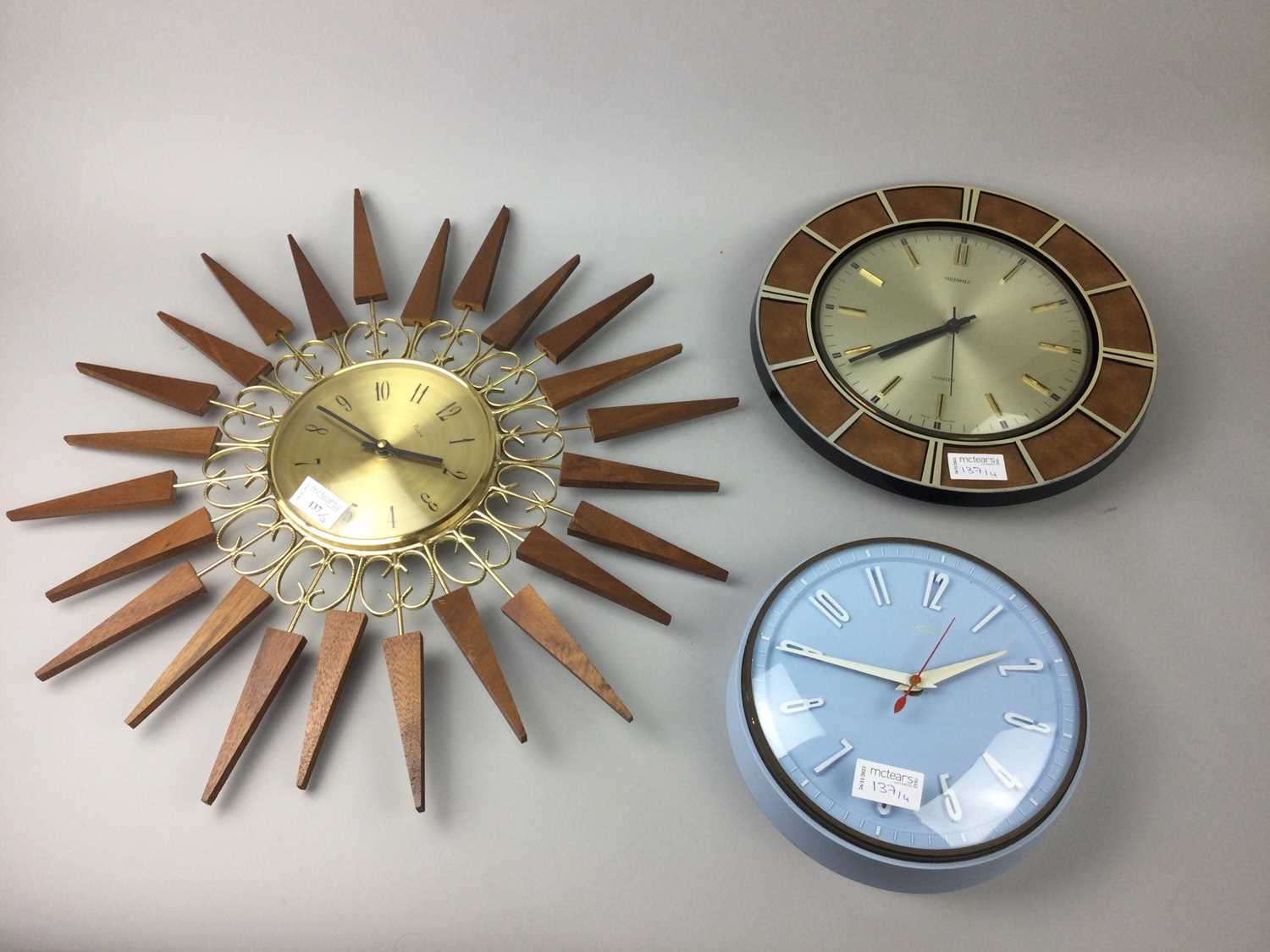 Lot 137 - A PAICO STARBURST WALL CLOCK AND THREE OTHER WALL CLOCKS
