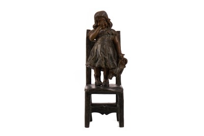 Lot 1043 - AN EARLY 20TH CENTURY BRONZE FIGURE OF A GIRL ON A CHAIR