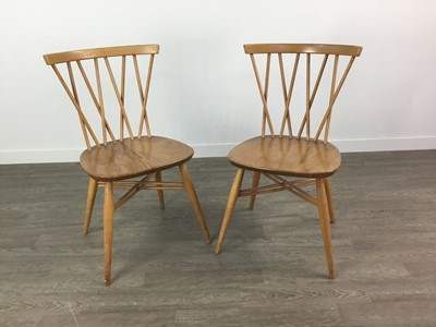 Lot 1048 - A SET OF FOUR ERCOL BLONDE ELM DINING CHAIRS