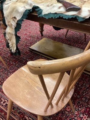 Lot 1048 - A SET OF FOUR ERCOL BLONDE ELM DINING CHAIRS