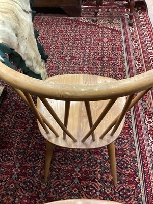 Lot 1048 - A SET OF FOUR ERCOL BLONDE ELM DINING CHAIRS