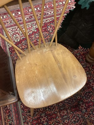 Lot 1048 - A SET OF FOUR ERCOL BLONDE ELM DINING CHAIRS