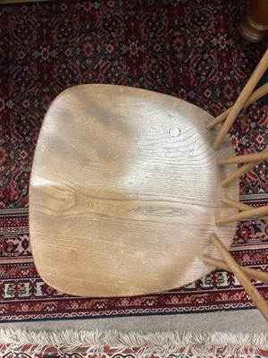 Lot 1048 - A SET OF FOUR ERCOL BLONDE ELM DINING CHAIRS