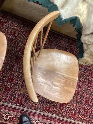 Lot 1048 - A SET OF FOUR ERCOL BLONDE ELM DINING CHAIRS