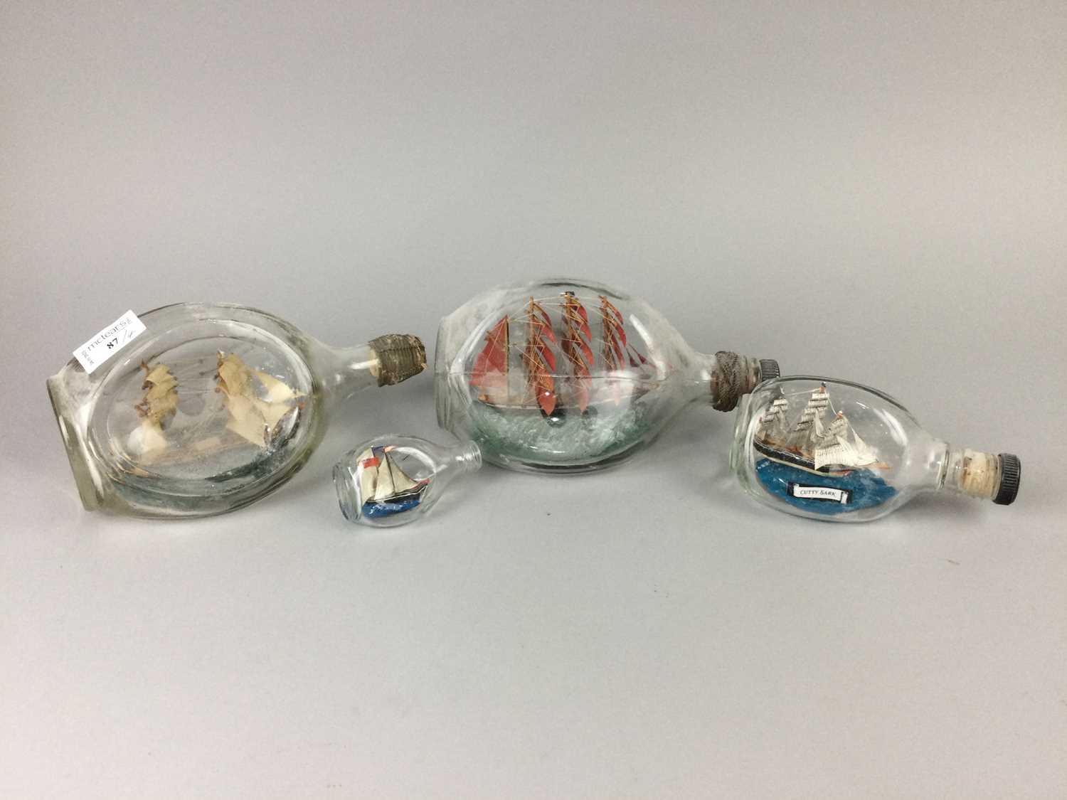 Lot 87 - A LOT OF FOUR GLASS SHIP IN BOTTLE MODELS