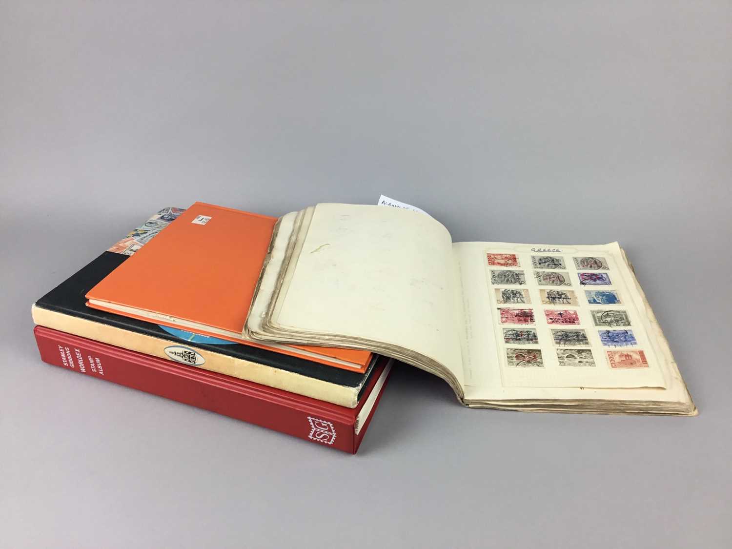Lot 108 - A LOT OF FOUR ALBUMS OF WORLD STAMPS