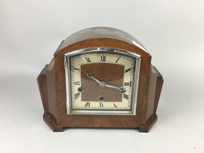 Lot 352 - AN ART DECO WALNUT CASED MANTEL CLOCK