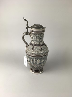 Lot 522 - A GERMAN STONEWARE LIDDED ALE JUG