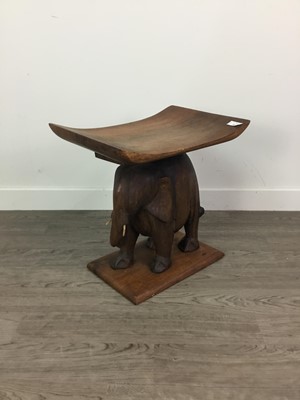 Lot 483 - AN EARLY 20TH CENTURY BURMESE TEAK ELEPHANT SIDE TABLE ALONG WITH A TAMBLE LAMP AND CANE