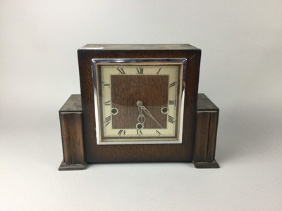 Lot 446 - AN ART DECO OAK CASED MANTEL CLOCK